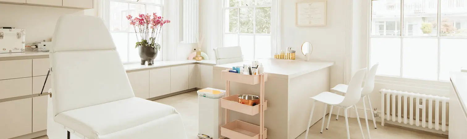 Modern lab with white chairs and a testing table.